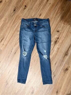 Ripped Mid-Rise Skinny Jeans in Washed Blue